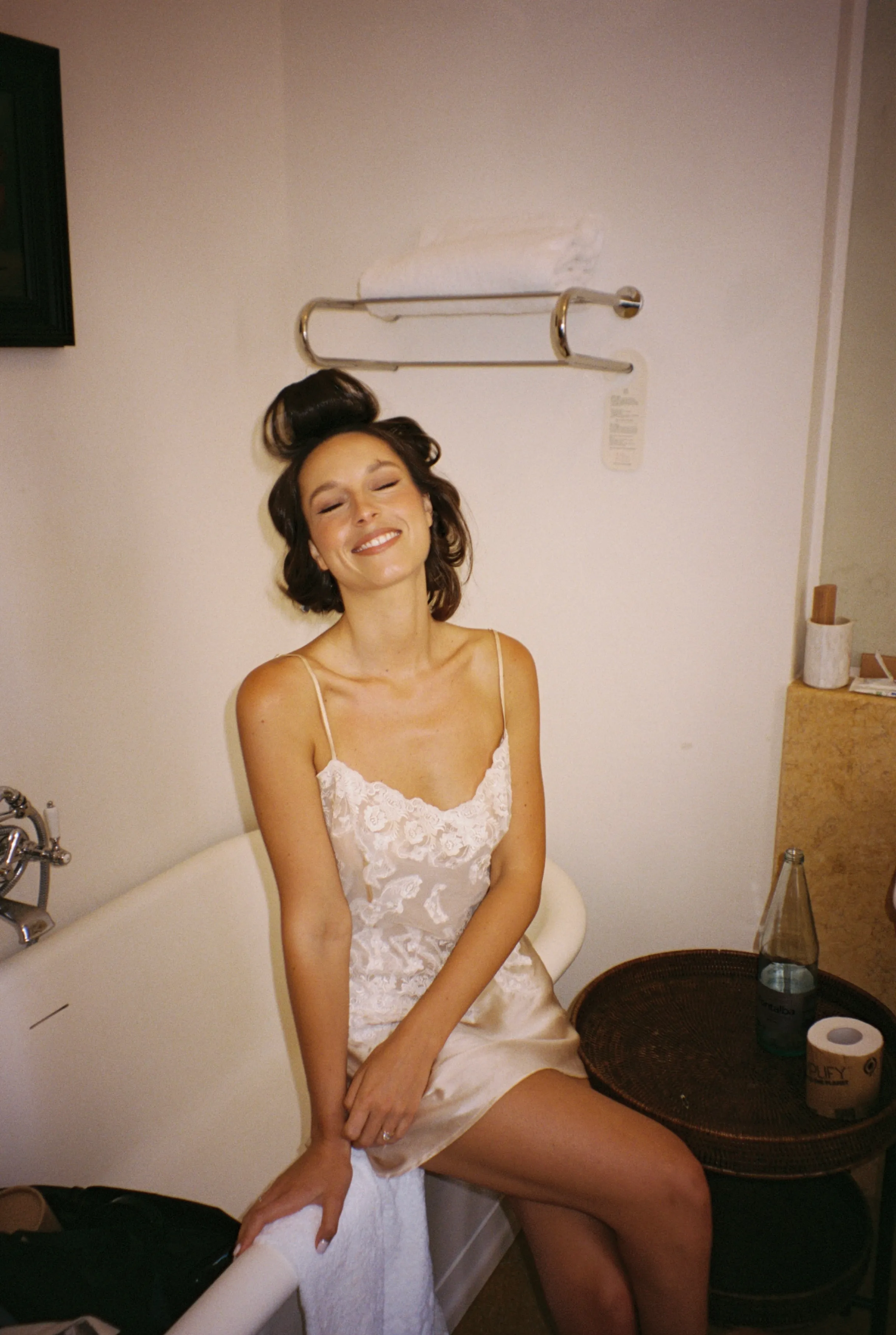 The bride laughing during preparations